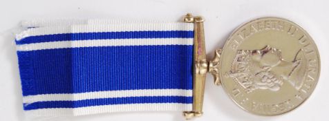 POLICE: A Police Exemplary Service medal and ribbon, unengraved to the rim.