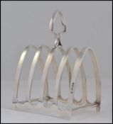 A silver hallmarked toast rack of smaller proportions,
