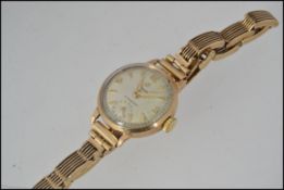 A good 9ct gold vintage ladies cyma - cymaflex dress / cocktail watch.