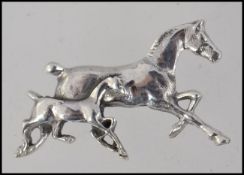 A 20th century ladies silver brooch in the form of a horse with its foal. Total weight 6.