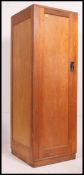 A vintage mid century wooden panel locker - ex Lyneham Air Force Base having full length door with