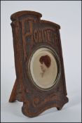 An unusual early 20th century Art Nouveau wooden photo frame carved Honfleur having a central