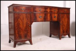 A large Canadian mahogany inlaid Federal / Regency bow front sideboard originally belonging to