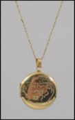A fine 9ct gold ladies necklace complete with clasp having a yellow metal locket.