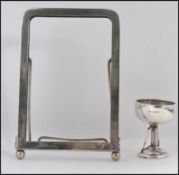 A silver hallmarked trophy / cup along with a silver plated easel picture frame Frame H18cm trophy