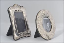2 small contemporary silver picture / photo frames with ribbon and foliate decoration each having