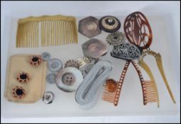 A collection of vintage ladies buttons to include yellow metal, mother of pearl,