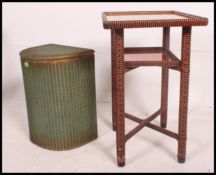 A Lloyd Loom linen basket with Lusty label and decorative retro vintage orange and black glass