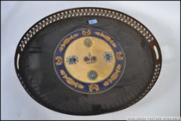 A good quality brass 20th century oval butlers tray with armorial painted coat of arms.