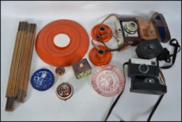 A collection of curios to include vintage 35mm cameras,