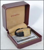 A 20th century Gentlemans Zenith wristwatch having gilded facia with baton numerals and subsiduary