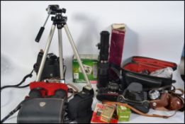 A collection of vintage 35 mm cameras to include Voigtlander, Practica, lenses,