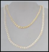 Two vintage cultured pearl necklaces, one with yellow metal spring hoop clasp,