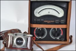 A vintage Avometer mark 6 together with a 35mm Paxette slr camera in leather case with pointikar