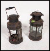 A pair of vintage 20th century antique metal storm lanterns,
