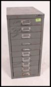 A retro upcycled Bisley grey metal filing Industrial cabinet having loop handles to each drawer