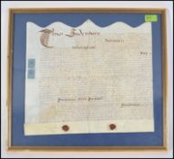 A framed and glazed 17th century indenture bearing the original wax seals.