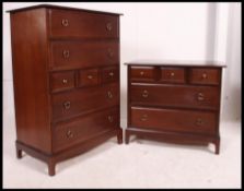A pair of Stag ' Minstrel ' mahogany chest of drawers to include the upright chest and a low chest.