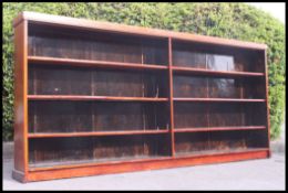 A large Victorian mahogany double solicitors - library bookcase being raised on plinth base with
