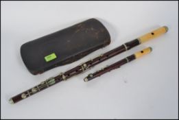 A 19th century Rosewood and nickel mounted thirteen keyed flute, unstamped, with ivory head joint,