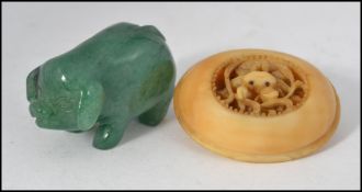 A small 20th century Jade carving of a pig, approx 4cm in length,