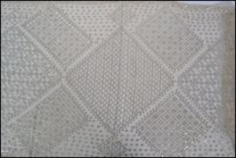 A large 1920s Egyptian hammered silver assuit wedding shawl made with cotton netting having hand