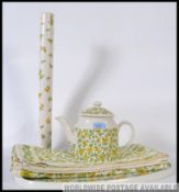A collection of Tauntan Vale items to include a retro Teapot, table cloth, tray,