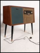 A vintage mid 20th century Bush radiogram having an inset RC121 Garrard deck.