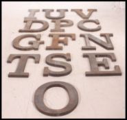 A collection of vintage Industrial advertising lettering of metal form.