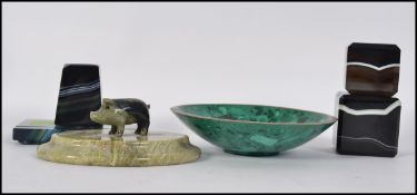 A pair of 20th century quartz paper weights along with a matching desk tidy / inkwell along with an