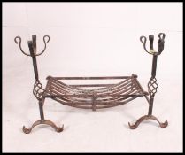 A stunning 20th century bespoke wrought iron open fire grate and matching fire dogs by Scottish