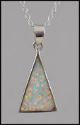 A ladies silver and opalite pendant necklace and chain, the opalite pendant of triangular form.