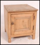 A Victorian pine country locker cabinet of small form having locker door with flared top above.