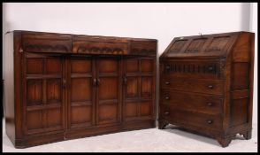 A good quality Jaycee bureau having linen fold carved slope over drawers together with a Jacobean