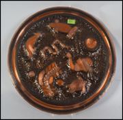 An unusual retro 1970's Australian copper wall mount plaque moulded in relief with aboriginal