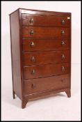 A mid 20th century oak straight six chest of drawers,