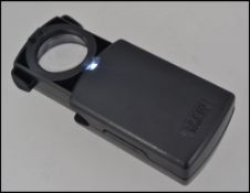 A new and unused jewellers loupe with magnifying glass and LED light.