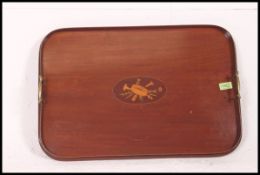 An Edwardian mahogany inlaid butlers tray with brass handles,