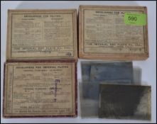 A collection of 3 boxes of black and white negative photographic plates to include, cycling, people,