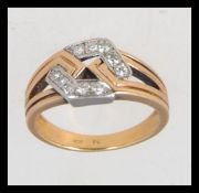 A tested 18ct gold and diamond ring of contemporary hexagonal form with channel set diamonds approx