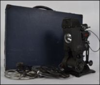 A vintage original Pathe 95 projector complete in the carry case with films to include scenes of