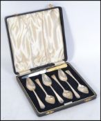 A silver hallmarked grapefruit spoon set complete in the original presentation case with later