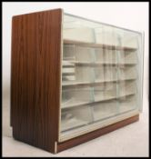 A 1970's faux teak wood and cream painted haberdashery unit - shop counter.