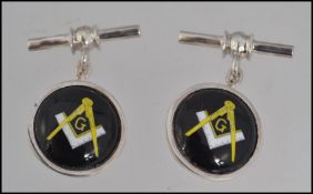 A pair of gentlemans silver masonic cufflinks,