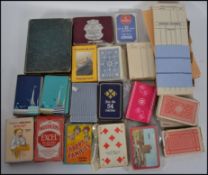 A collection of playing cards to include vintage cased sets,