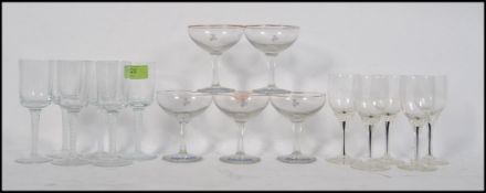 A collection of Babycham glasses ( 5) together with a set of 6 sherry glasses with spiral twist