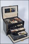 A good quality jewellery box containing a collection of costume jewellery such as necklaces,