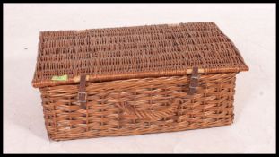 A retro vintage whicker mid century picnic hamper,