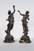 A pair of spelter male and female figures of Harvest with applied gilded finish representing