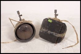 A pair of vintage 20th century theatre spot lights, one retaining barn doors,